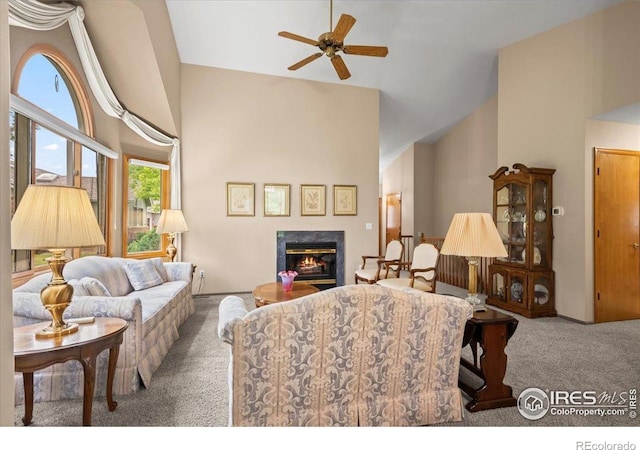 1528 16th Pl, Longmont, CO 80501 - carpeted living room with high vaulted ceiling, ceiling fan, and a premium fireplace