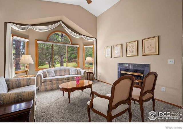 1528 16th Pl, Longmont, CO 80501 - carpeted living room with a fireplace, baseboards, and vaulted ceiling