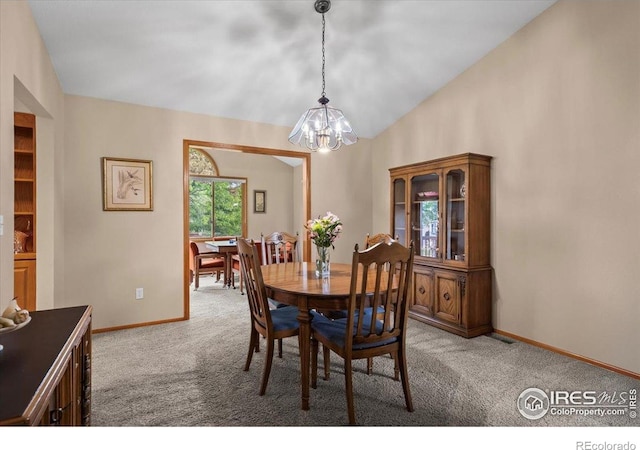 1528 16th Pl, Longmont, CO 80501 - dining area with a chandelier, carpet floors, baseboards, and lofted ceiling