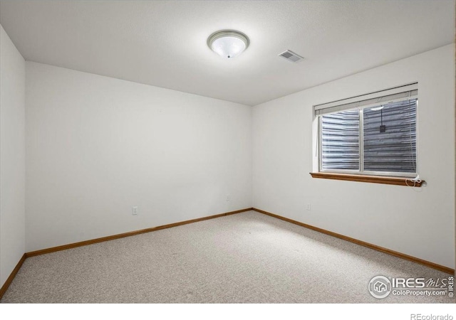 1528 16th Pl, Longmont, CO 80501 - carpeted spare room with baseboards