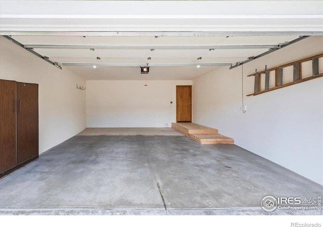 1528 16th Pl, Longmont, CO 80501 - garage featuring a garage door opener