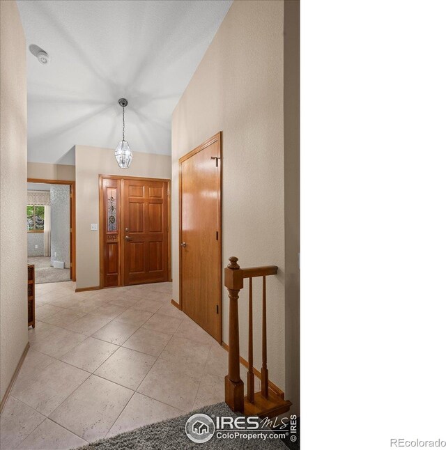 1528 16th Pl, Longmont, CO 80501 - entrance foyer with baseboards and vaulted ceiling
