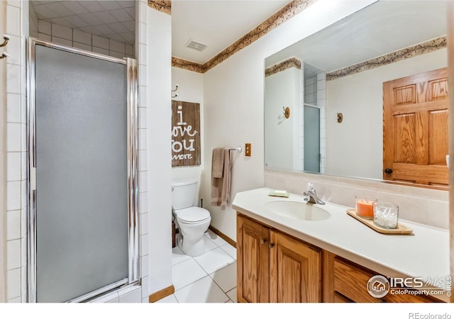 216 N Gold Flake, Breckenridge, CO 80424 - bathroom featuring toilet, vanity, a stall shower, tile patterned flooring, and baseboards