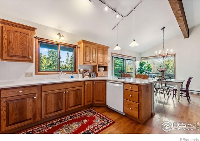 216 N Gold Flake, Breckenridge, CO 80424 - kitchen featuring dishwasher, a sink, track lighting, a peninsula, and light wood-type flooring