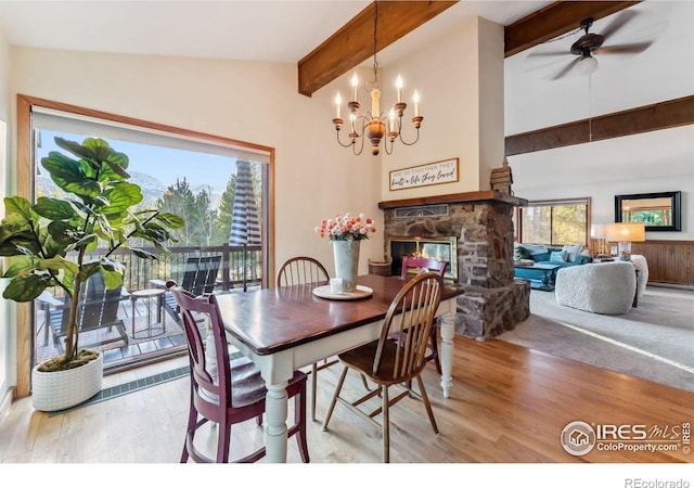 216 N Gold Flake, Breckenridge, CO 80424 - dining area featuring beamed ceiling, a fireplace, wood finished floors, a ceiling fan, and a chandelier