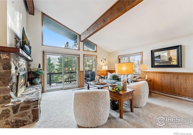216 N Gold Flake, Breckenridge, CO 80424 - carpeted living room featuring beamed ceiling, a baseboard heating unit, a wainscoted wall, a fireplace, and high vaulted ceiling