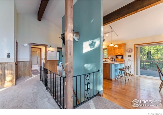 216 N Gold Flake, Breckenridge, CO 80424 - staircase with beam ceiling, rail lighting, wainscoting, wood finished floors, and high vaulted ceiling