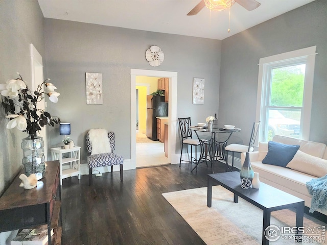 936 E 4th St, Loveland, CO 80537 - living room featuring ceiling fan, wood finished floors, and baseboards