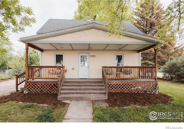 1155 Monroe Ave, Loveland, CO 80537 - bungalow with covered porch and roof with shingles