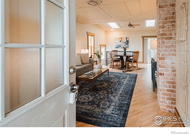 1155 Monroe Ave, Loveland, CO 80537 - living room with a ceiling fan, light wood finished floors, and plenty of natural light