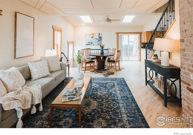 1155 Monroe Ave, Loveland, CO 80537 - living area with wood finished floors, stairway, and ceiling fan