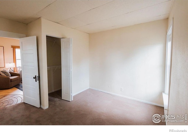 1155 Monroe Ave, Loveland, CO 80537 - unfurnished bedroom with carpet, baseboards, and a closet