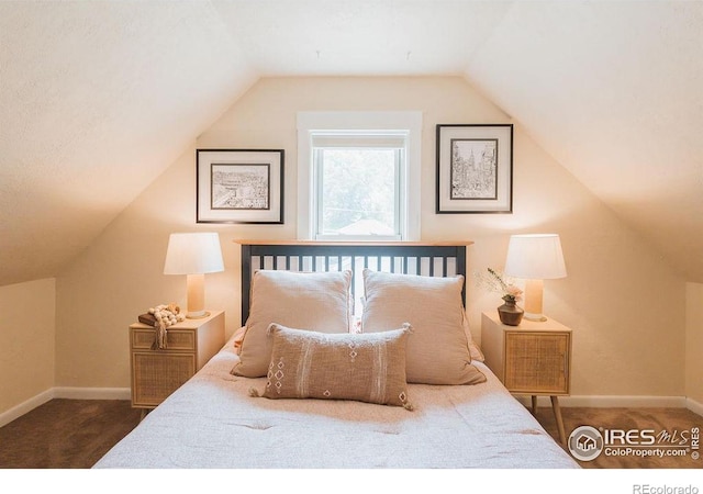 1155 Monroe Ave, Loveland, CO 80537 - bedroom with carpet floors, baseboards, and vaulted ceiling