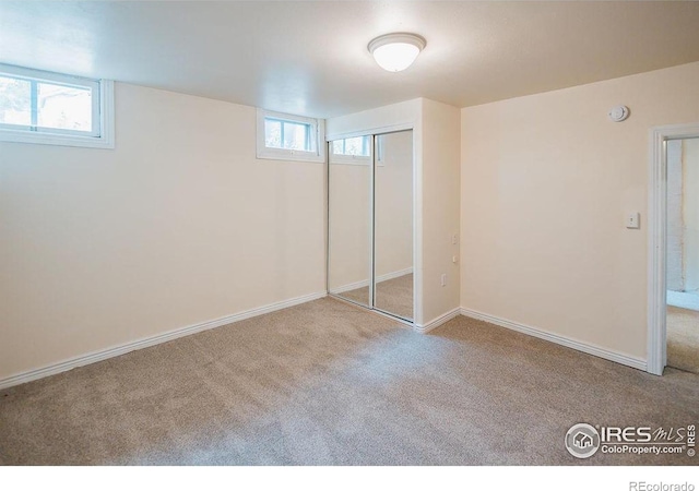 1155 Monroe Ave, Loveland, CO 80537 - unfurnished bedroom featuring carpet floors, a closet, and baseboards
