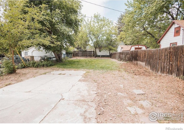 1155 Monroe Ave, Loveland, CO 80537 - view of yard featuring a patio