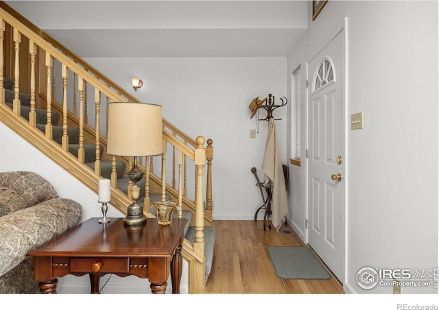 266 Gap Rd, Black Hawk, CO 80422 - foyer with stairs, wood finished floors, and baseboards