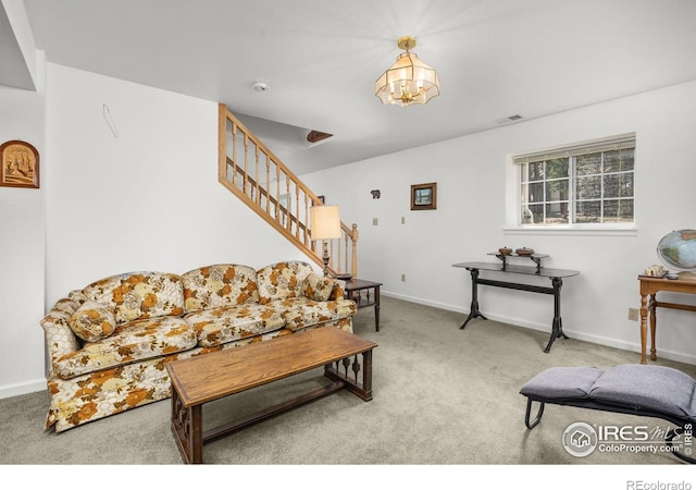 266 Gap Rd, Black Hawk, CO 80422 - living room with carpet floors, a chandelier, stairway, and baseboards