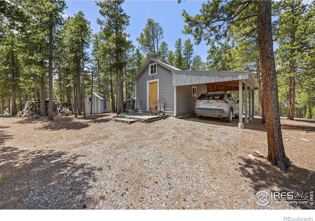 266 Gap Rd, Black Hawk, CO 80422 - view of shed featuring dirt driveway and an attached carport