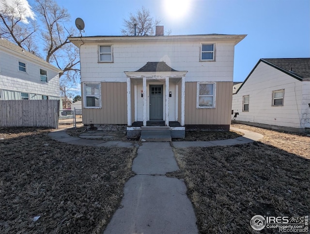 525 Jackson St, Sterling, CO 80751 - view of front of property with a chimney and board and batten siding