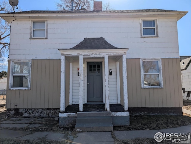 525 Jackson St, Sterling, CO 80751 - view of front of house with a chimney