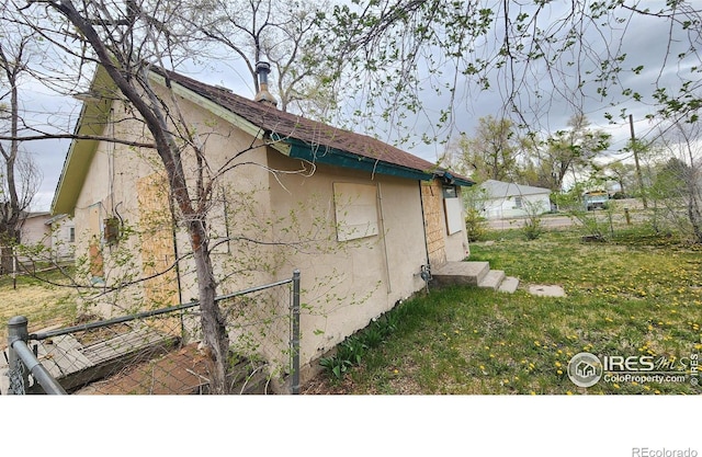 701 Phelps St, Sterling, CO 80751 - view of side of property featuring stucco siding