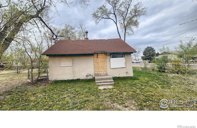 701 Phelps St, Sterling, CO 80751 - view of front facade with stucco siding and entry steps