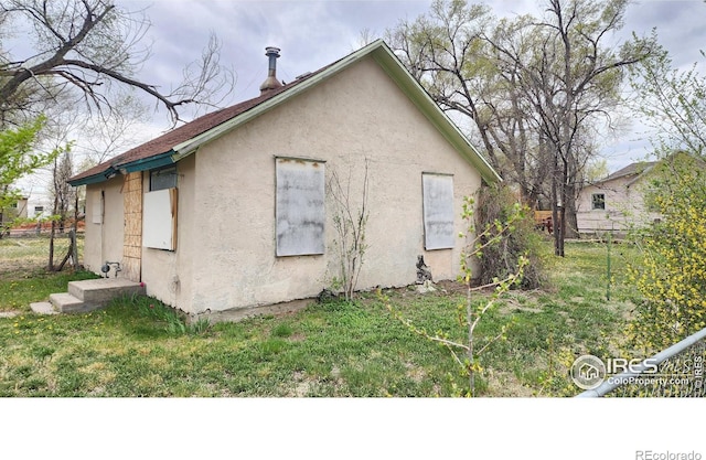 701 Phelps St, Sterling, CO 80751 - view of side of property featuring stucco siding