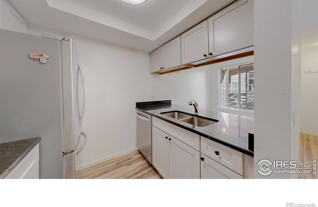 6110 Habitat Dr Unit 2, Boulder, CO 80301 - kitchen with appliances with stainless steel finishes, a sink, light wood-style flooring, and white cabinets