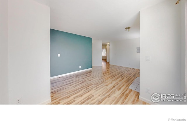 6110 Habitat Dr Unit 2, Boulder, CO 80301 - unfurnished room with wood finished floors and baseboards