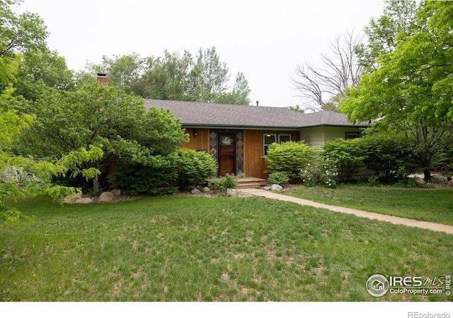 508 W 11th St, Loveland, CO 80537 - single story home featuring a front lawn and a chimney