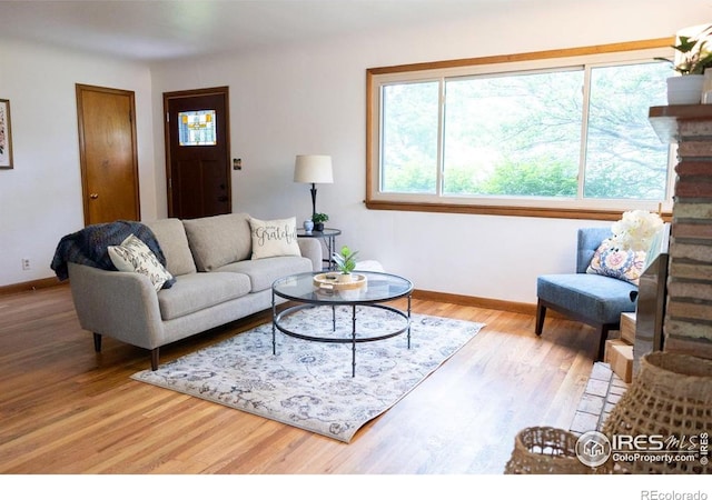 508 W 11th St, Loveland, CO 80537 - living area with baseboards and wood finished floors