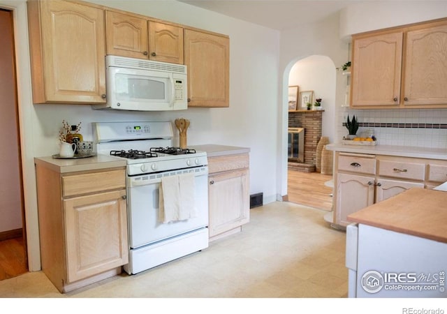 508 W 11th St, Loveland, CO 80537 - kitchen featuring white appliances, light brown cabinetry, light flooring, and light countertops