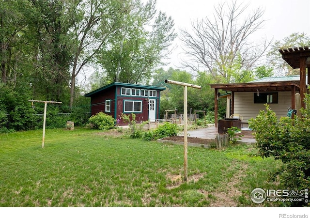 508 W 11th St, Loveland, CO 80537 - view of green lawn with a patio area and an outdoor structure