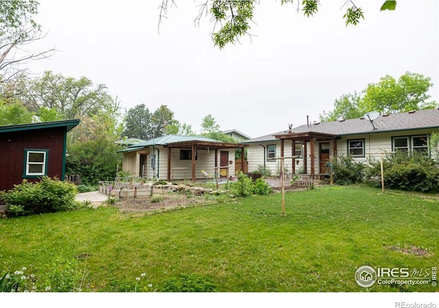 508 W 11th St, Loveland, CO 80537 - rear view of property featuring a lawn