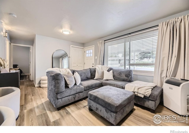 3245 W Walsh Pl, Denver, CO 80219 - living room featuring light wood-style flooring and baseboards