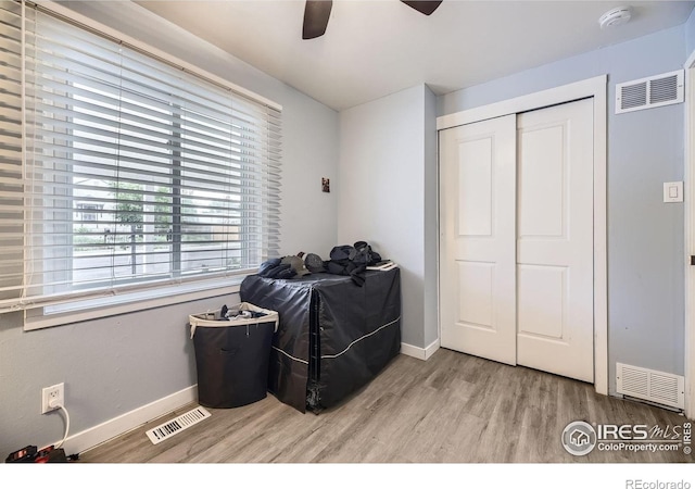 3245 W Walsh Pl, Denver, CO 80219 - sitting room with a heating unit, wood finished floors, baseboards, and ceiling fan