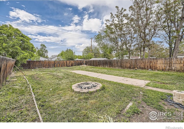3245 W Walsh Pl, Denver, CO 80219 - view of yard with a fire pit