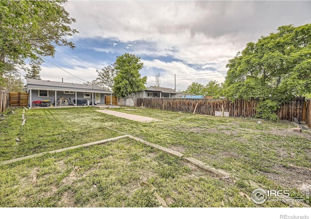 3245 W Walsh Pl, Denver, CO 80219 - view of yard featuring a patio