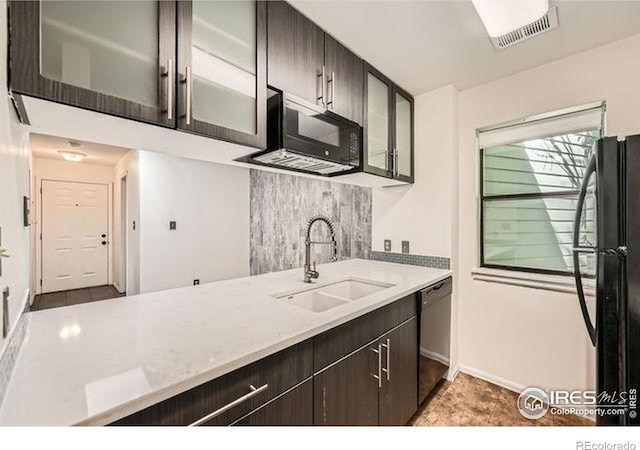 1830 22nd St Unit 15, Boulder, CO 80302 - kitchen featuring black appliances, a sink, glass insert cabinets, and dark brown cabinetry