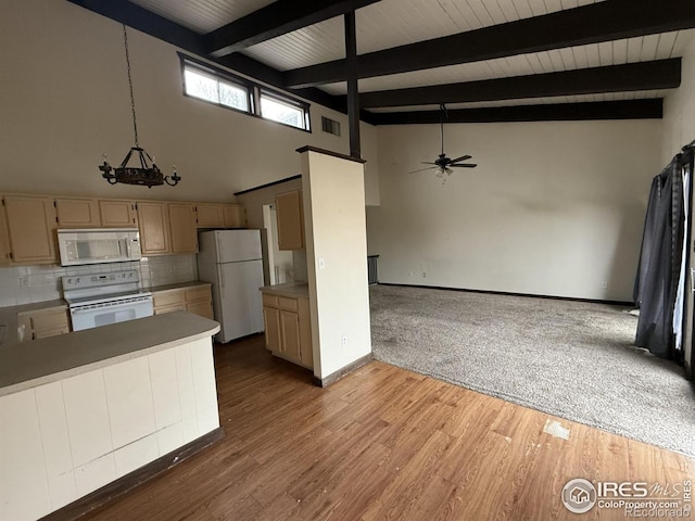 1943 Meadow Dr Unit B2, Longmont, CO 80501 - kitchen with white appliances, ceiling fan, tasteful backsplash, open floor plan, and baseboards