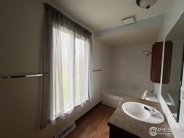 1943 Meadow Dr Unit B2, Longmont, CO 80501 - full bathroom with vanity, wood finished floors, and a bath