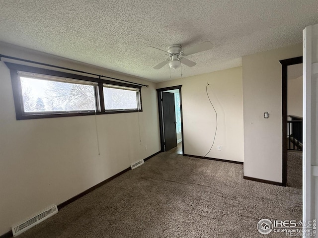 1943 Meadow Dr Unit B2, Longmont, CO 80501 - unfurnished bedroom featuring carpet floors, a textured ceiling, baseboards, and a ceiling fan