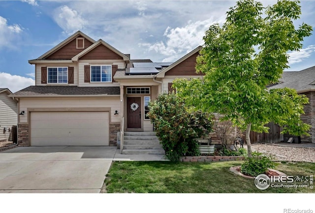 475 Homestead Ln, Johnstown, CO 80534 - craftsman-style house featuring an attached garage, solar panels, concrete driveway, a front yard, and stone siding