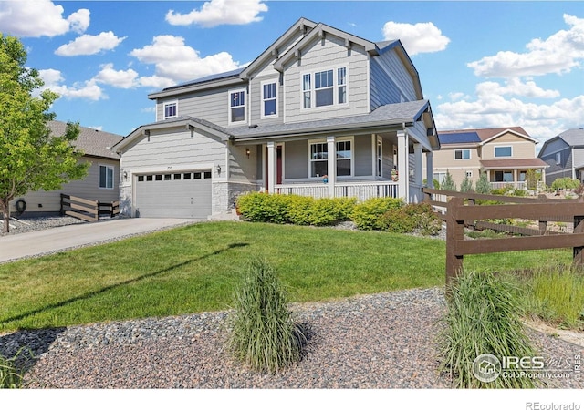 759 Old Wagon Trail Cir, Lafayette, CO 80026 - view of front of house featuring covered porch, driveway, and stone siding