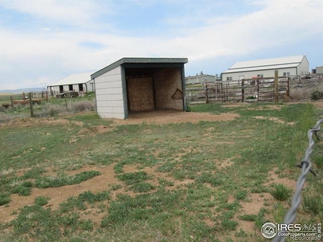 3301 Hackamore Rd, Wellington, CO 80549 - view of yard featuring an outbuilding, an outdoor structure, and a carport