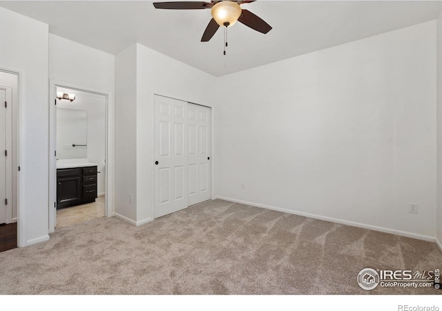 6614 Neota Creek Ct, Timnath, CO 80547 - unfurnished bedroom with light colored carpet, ensuite bathroom, baseboards, and a closet