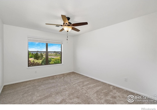 6614 Neota Creek Ct, Timnath, CO 80547 - unfurnished room featuring carpet flooring, a ceiling fan, and baseboards