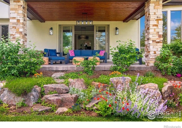 7205 Rustic Trl, Boulder, CO 80301 - doorway to property featuring a porch and stucco siding