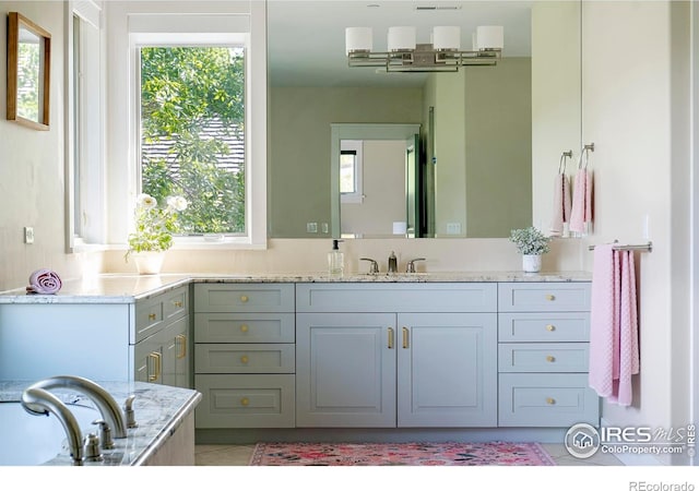 7205 Rustic Trl, Boulder, CO 80301 - bathroom featuring vanity, tile patterned floors, and a tub to relax in