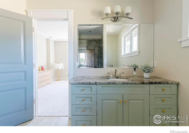 7205 Rustic Trl, Boulder, CO 80301 - bathroom featuring vanity, a tile shower, and tile patterned floors